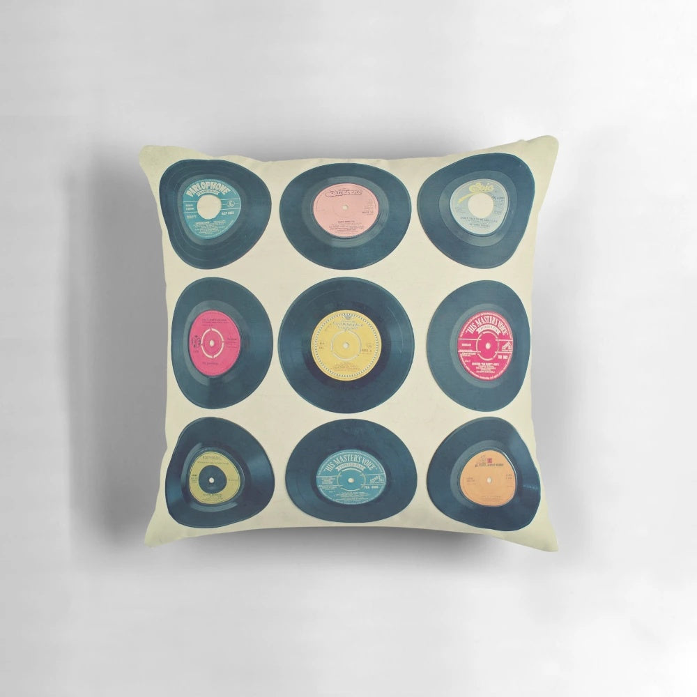 Colorful patterned pillow featuring retro vinyl records and a vintage-inspired design