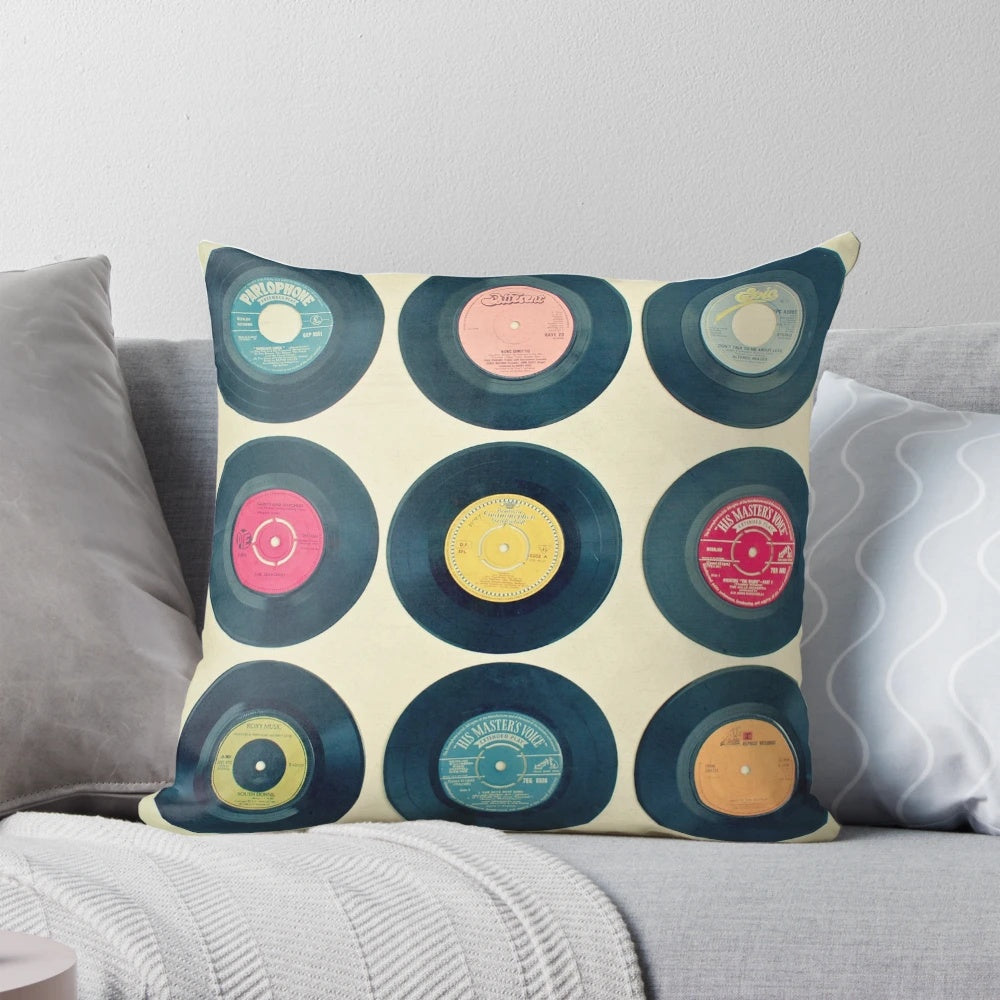 Colorful patterned pillow featuring retro vinyl records and a vintage-inspired design