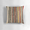 Decorative throw pillow featuring a vibrant, abstract photograph of a vinyl record collection