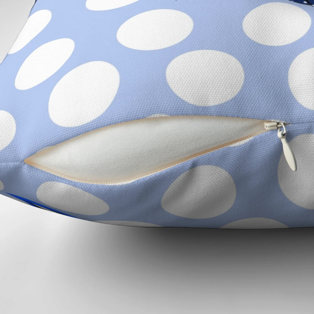 A decorative throw pillow featuring an abstract, nature-inspired pattern of a vulturine guinea fowl in shades of blue, grey, black, and white.