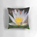 A colorful and artistic water lily flower printed on a decorative throw pillow.
