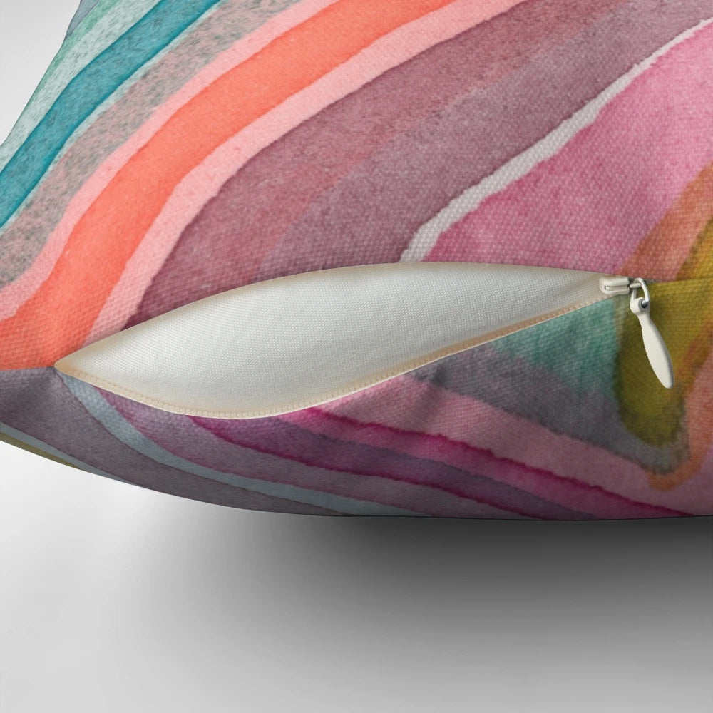 A colorful, bold, and modern watercolor abstract geometric chevron pattern pillow.