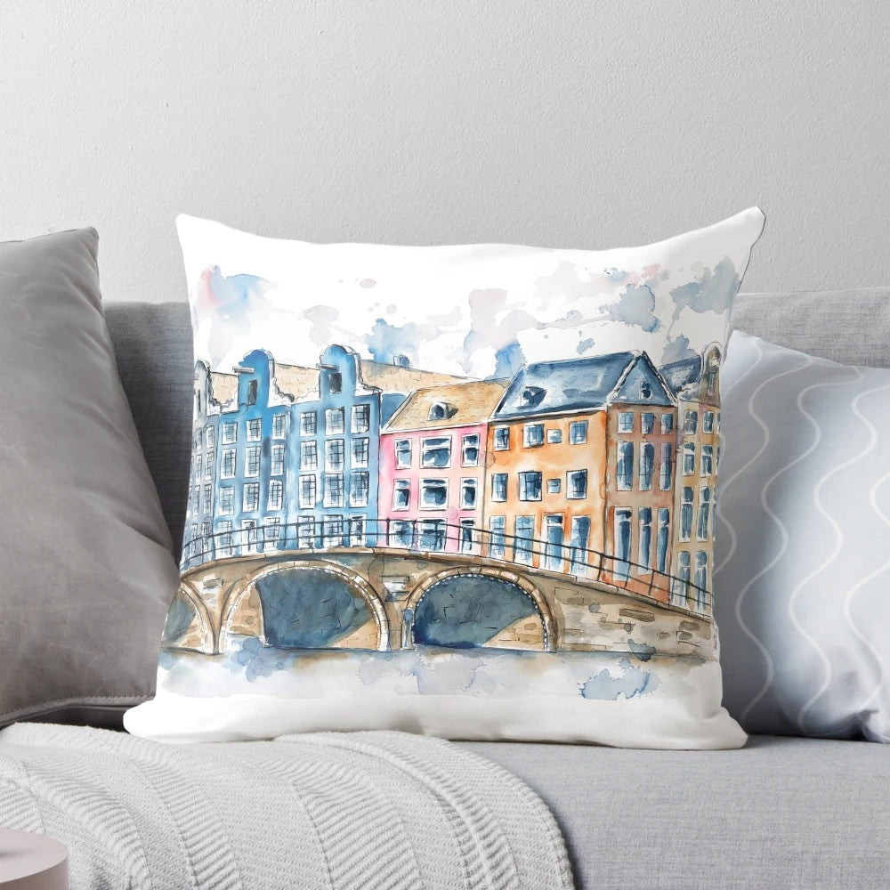 Colorful watercolor painting of traditional Amsterdam houses, bridges, and canals, printed on a plush pillow.