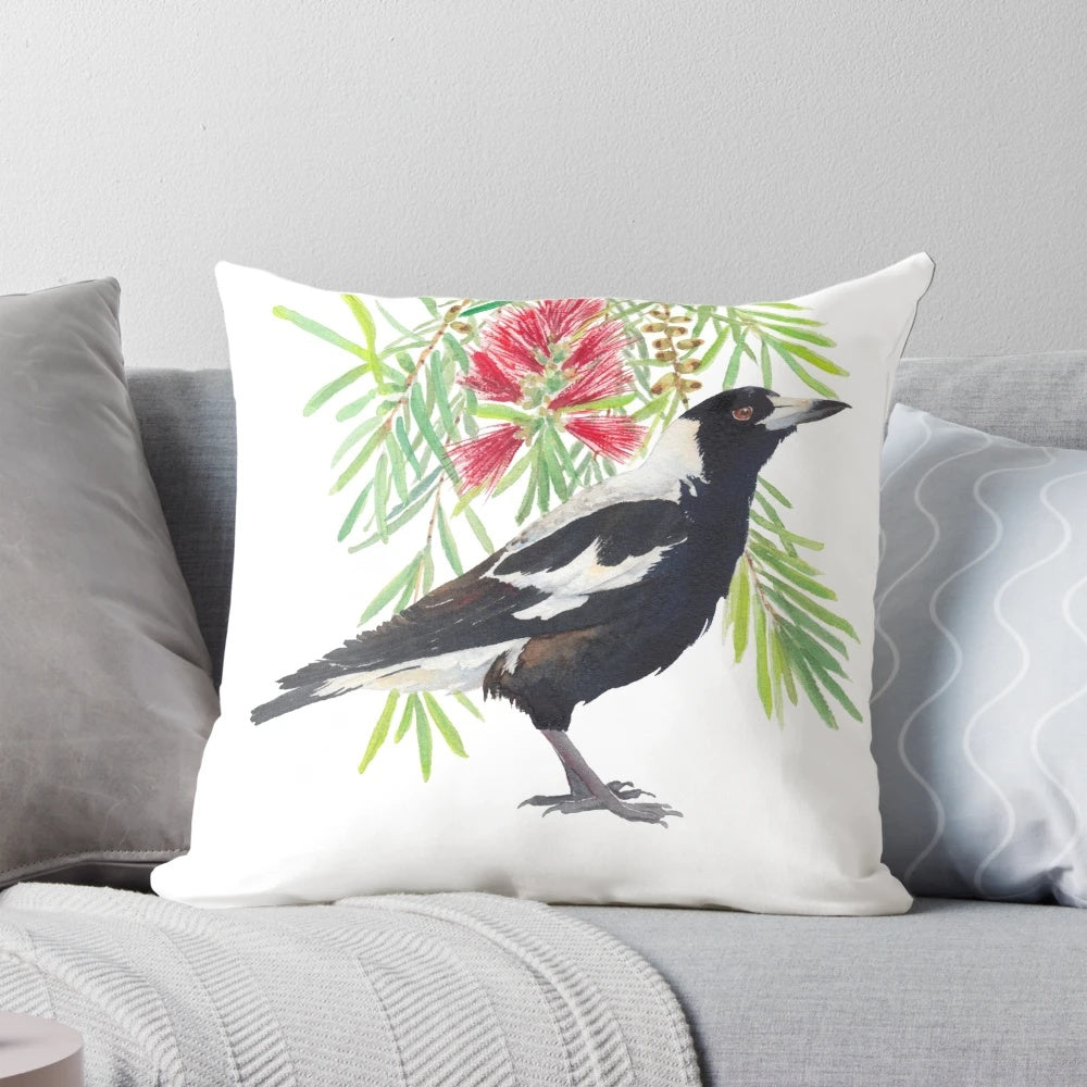 Colorful watercolor illustration of an Australian magpie bird perched on a bottlebrush tree branch with red flowers.