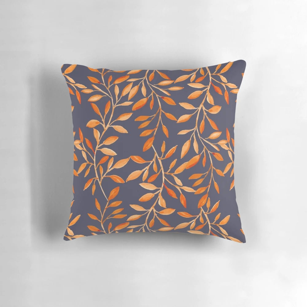 Decorative pillow featuring a vibrant watercolor pattern of autumn leaves