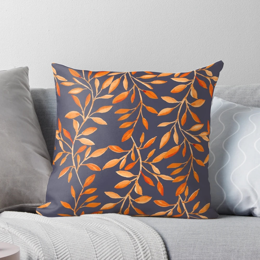 Decorative pillow featuring a vibrant watercolor pattern of autumn leaves
