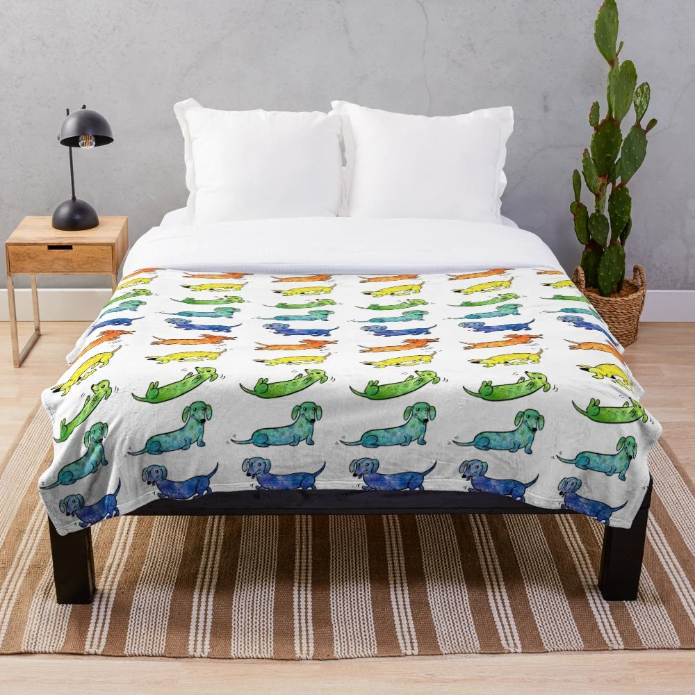Watercolor illustration of dachshund dogs on a plush, soft blanket