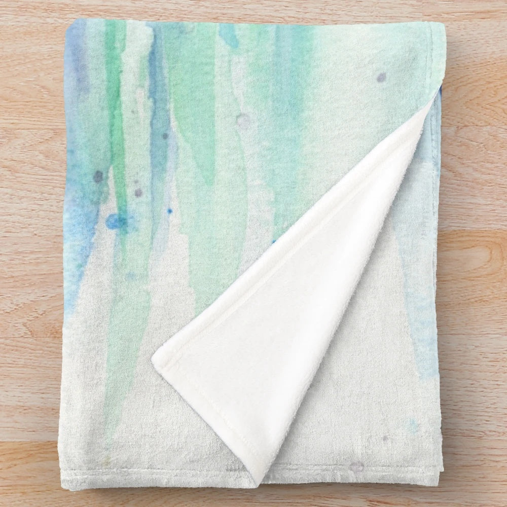 Colorful watercolor dolphin illustration on a plush blanket