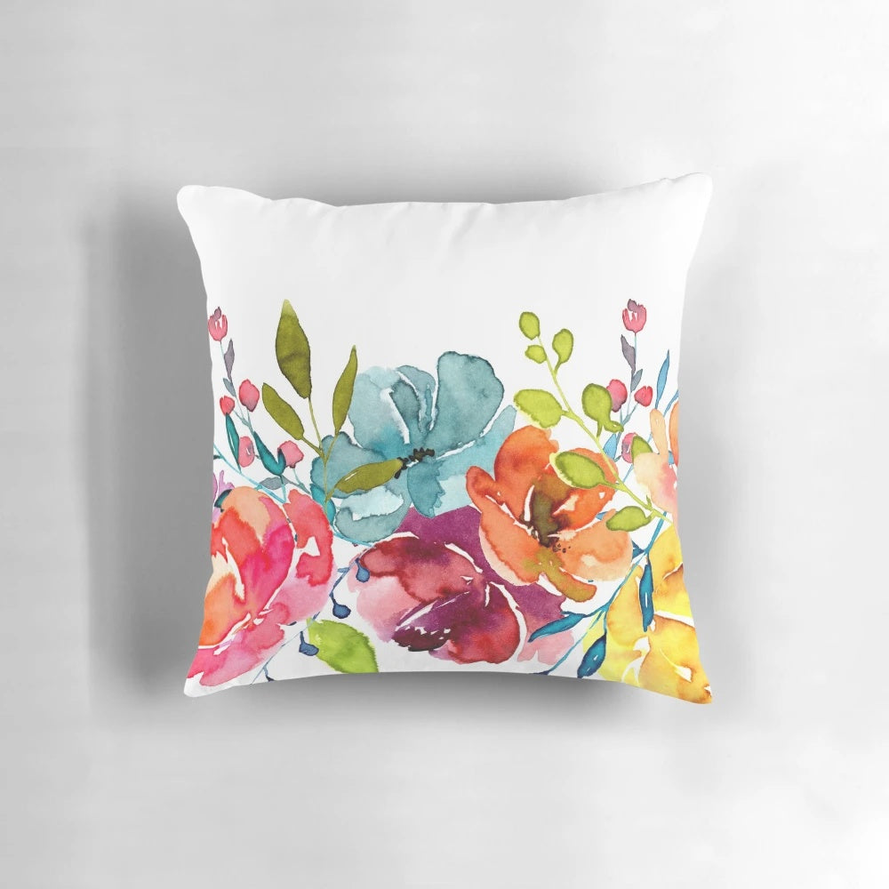 Colorful watercolor painting of bright pink peonies on a decorative throw pillow