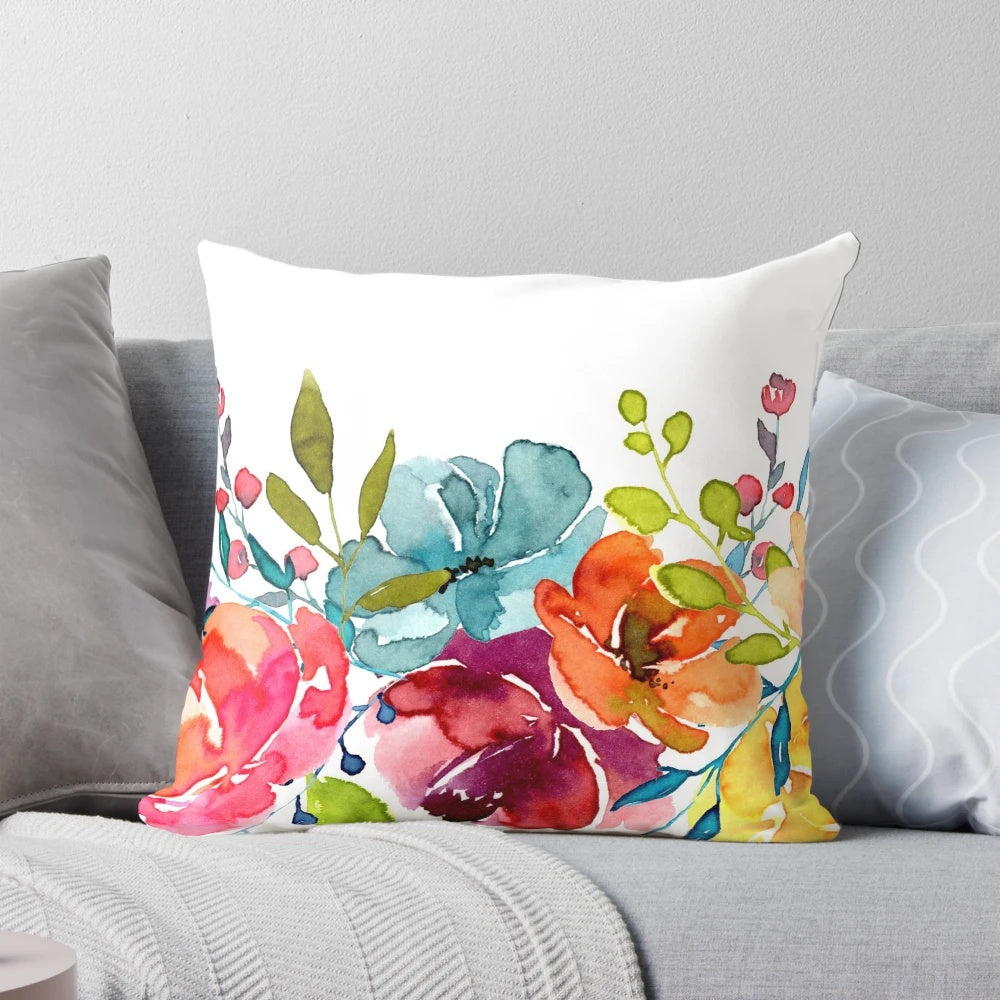 Colorful watercolor painting of bright pink peonies on a decorative throw pillow