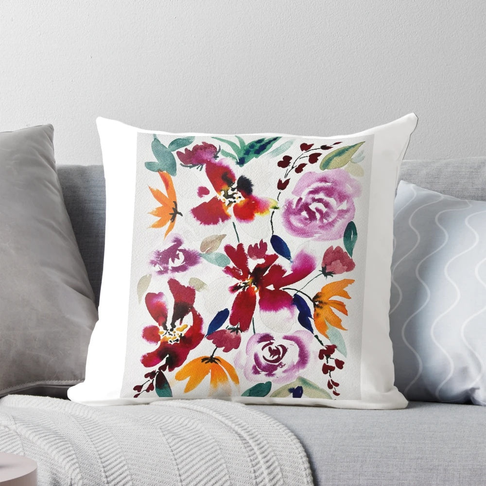 Bright and bold watercolor floral pattern on a lush, decorative pillow.