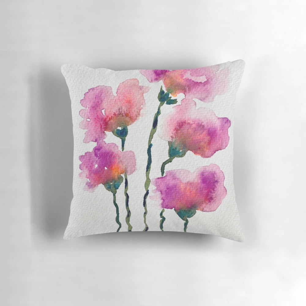 Colorful watercolor floral pattern on a decorative throw pillow