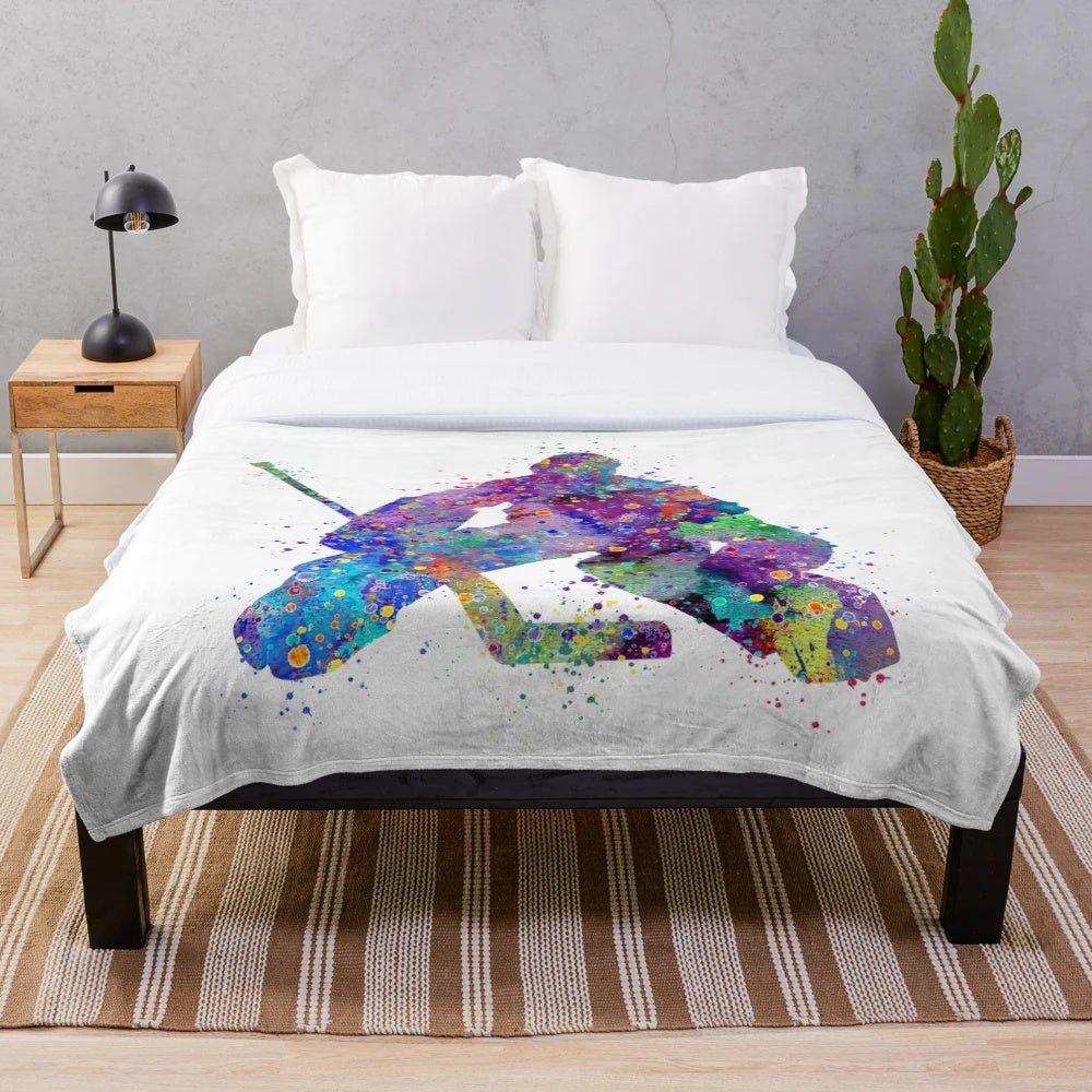 Colorful watercolor illustration of an ice hockey goalie on a plush blanket