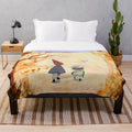 Vibrant watercolor-inspired plush blanket featuring the characters Wirt, Greg, and Beatrice from the animated series Over the Garden Wall