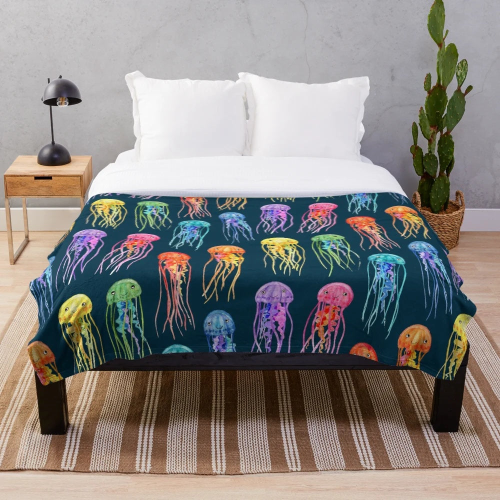Watercolor jellies design on a teal plush blanket