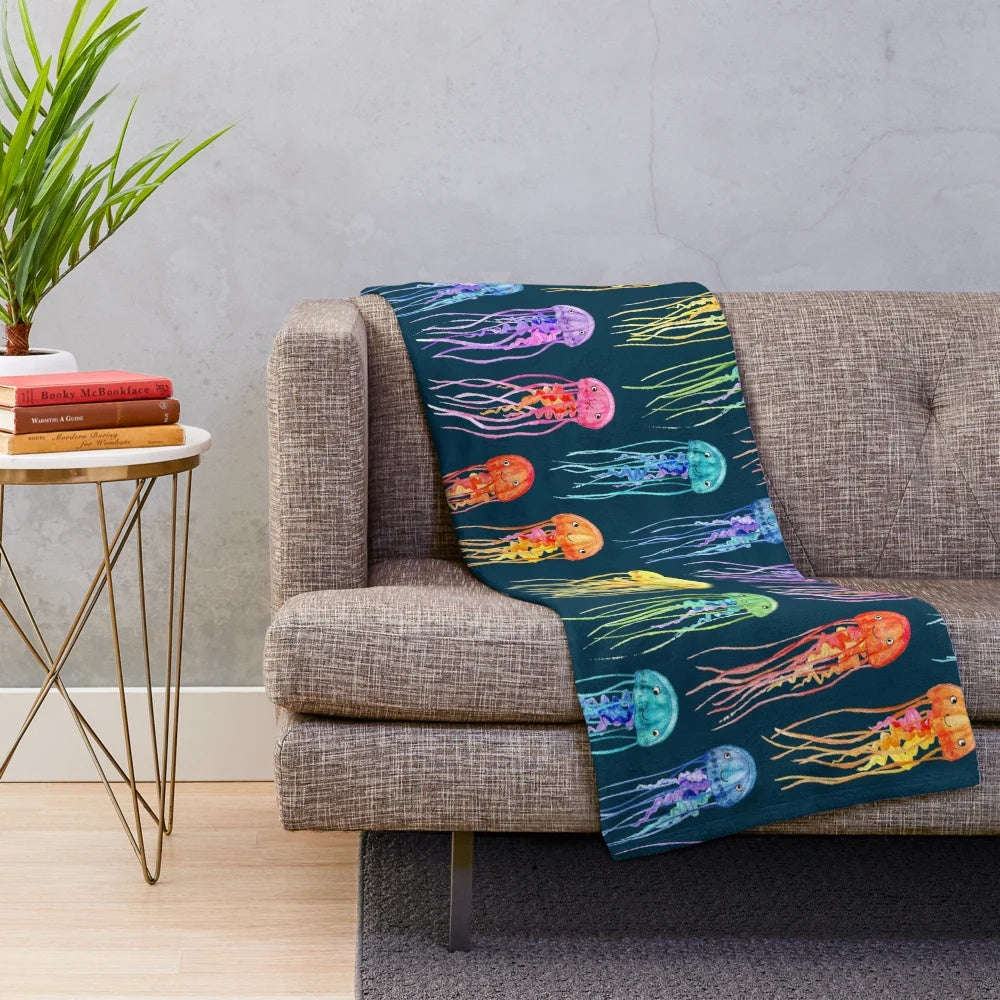 Watercolor jellies design on a teal plush blanket