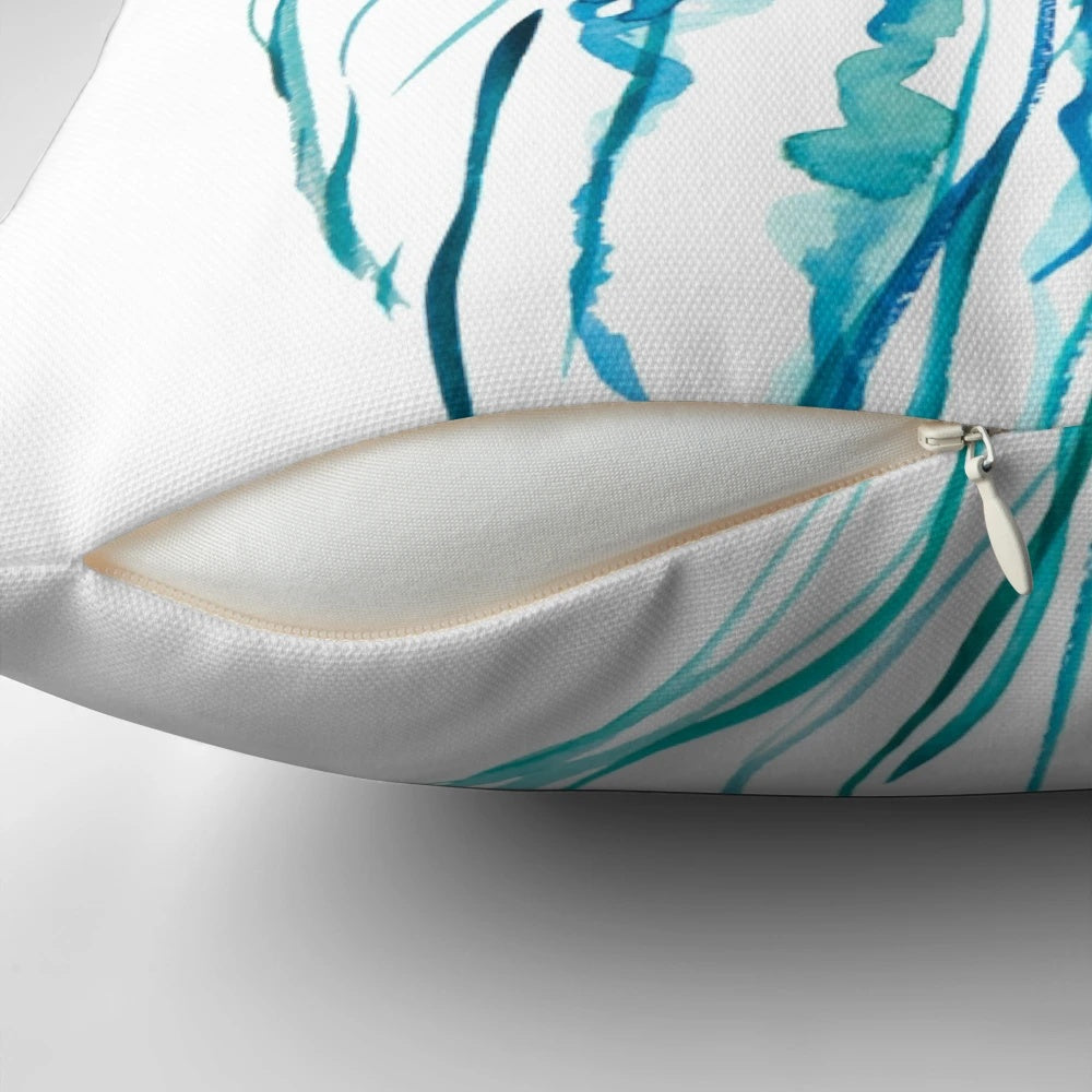 Watercolor painting of a jellyfish on a decorative throw pillow for coastal home decor