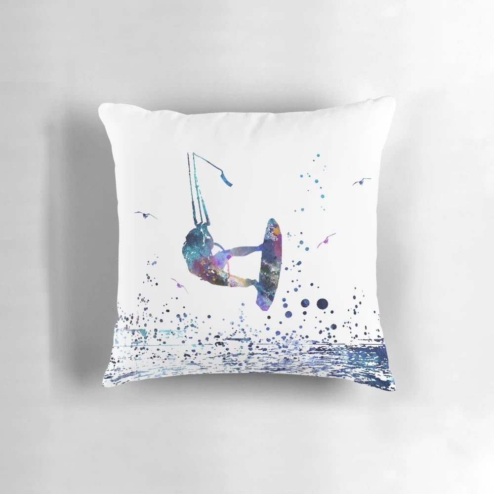 Colorful watercolor painting of a kitesurfer riding the waves, printed on a soft, square pillow.