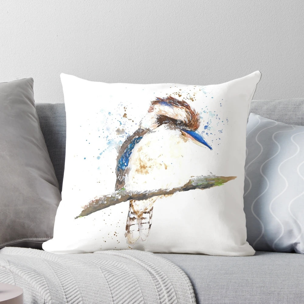 Vibrant watercolor illustration of a kookaburra, a native Australian bird, on a decorative throw pillow.