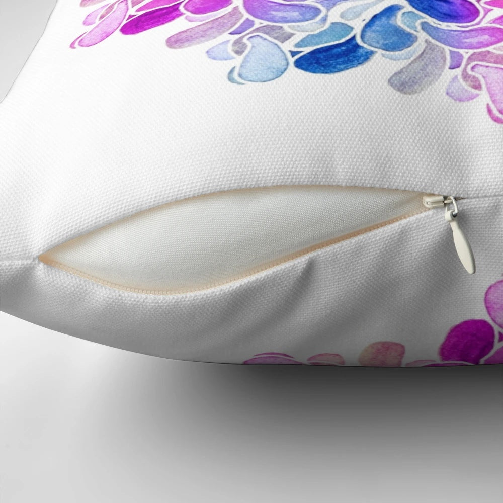 A vibrant, colorful throw pillow featuring a watercolor paisley floral design in shades of purple, blue, and pink.