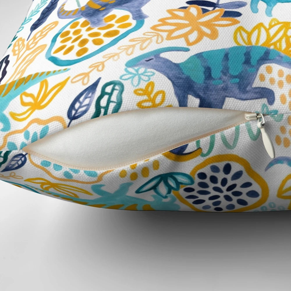 A vibrant watercolor and gouache painting of a parasaurolophus dinosaur on a plush pillow.