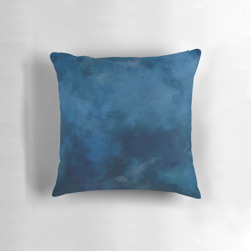 A blue and white abstract watercolor pattern decorative throw pillow.
