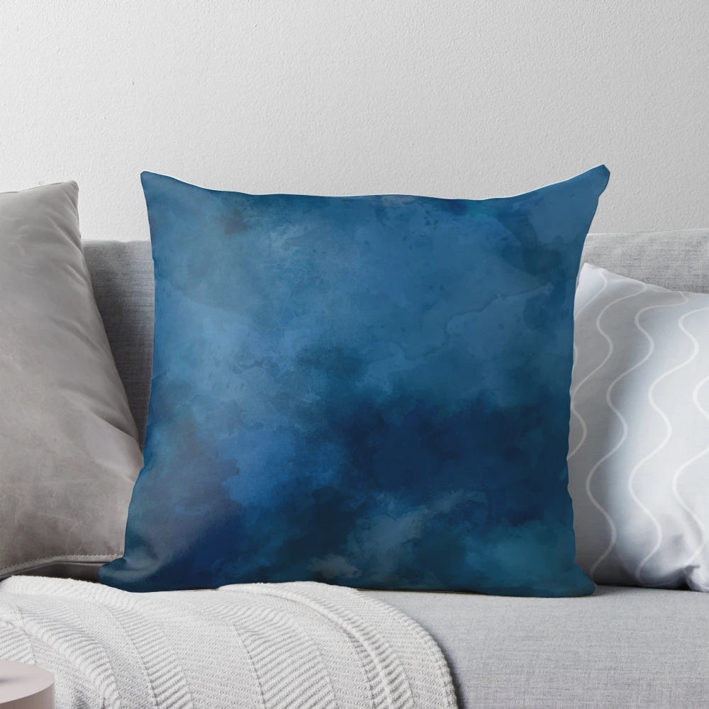 A blue and white abstract watercolor pattern decorative throw pillow.