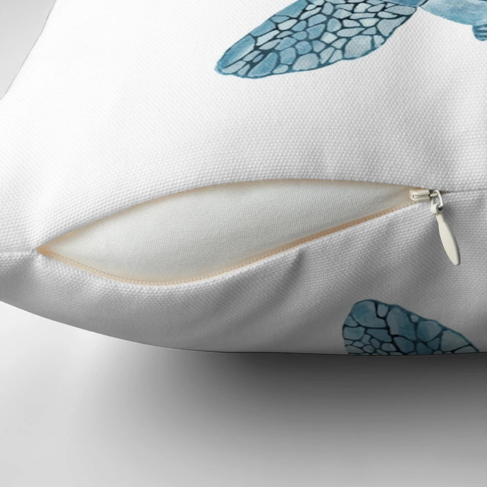 Closeup of a vibrant watercolor painting of a sea turtle in shades of turquoise and blue on a decorative throw pillow