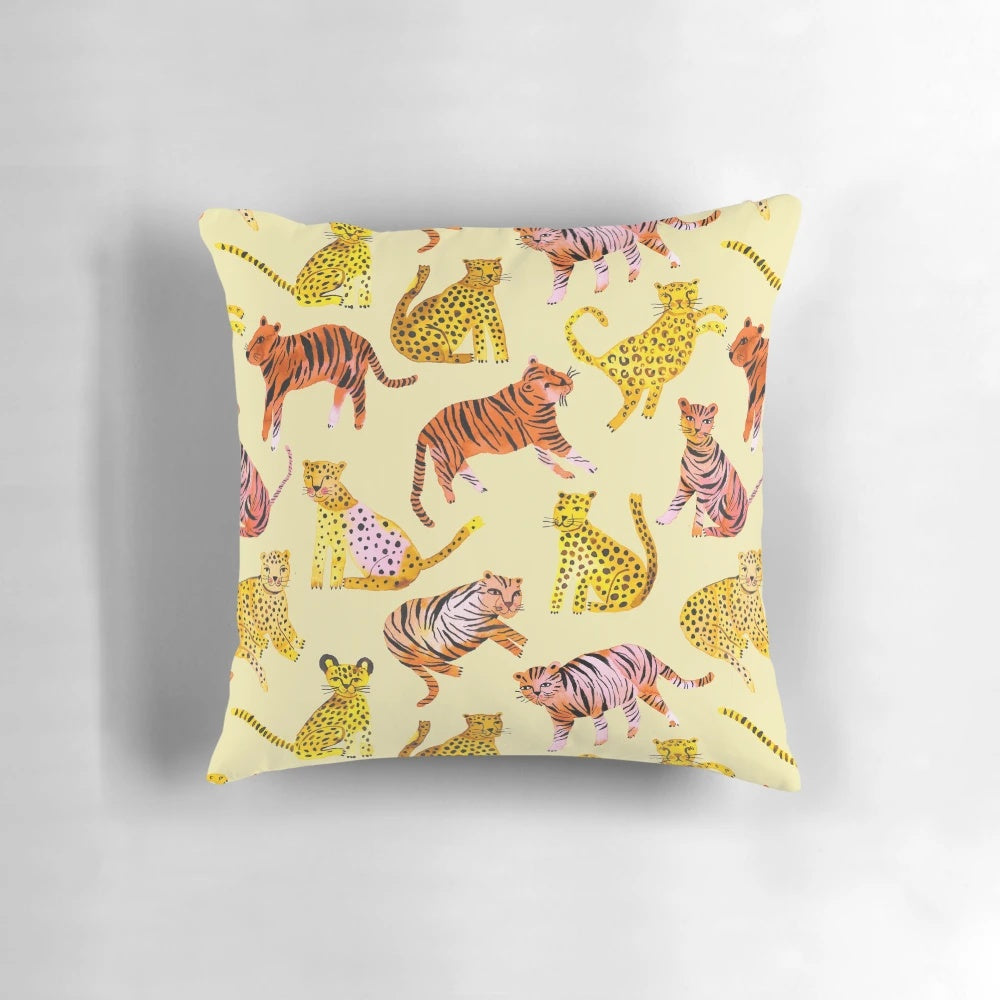 Decorative throw pillow featuring a vibrant watercolor painting of tigers and leopards in the African savannah