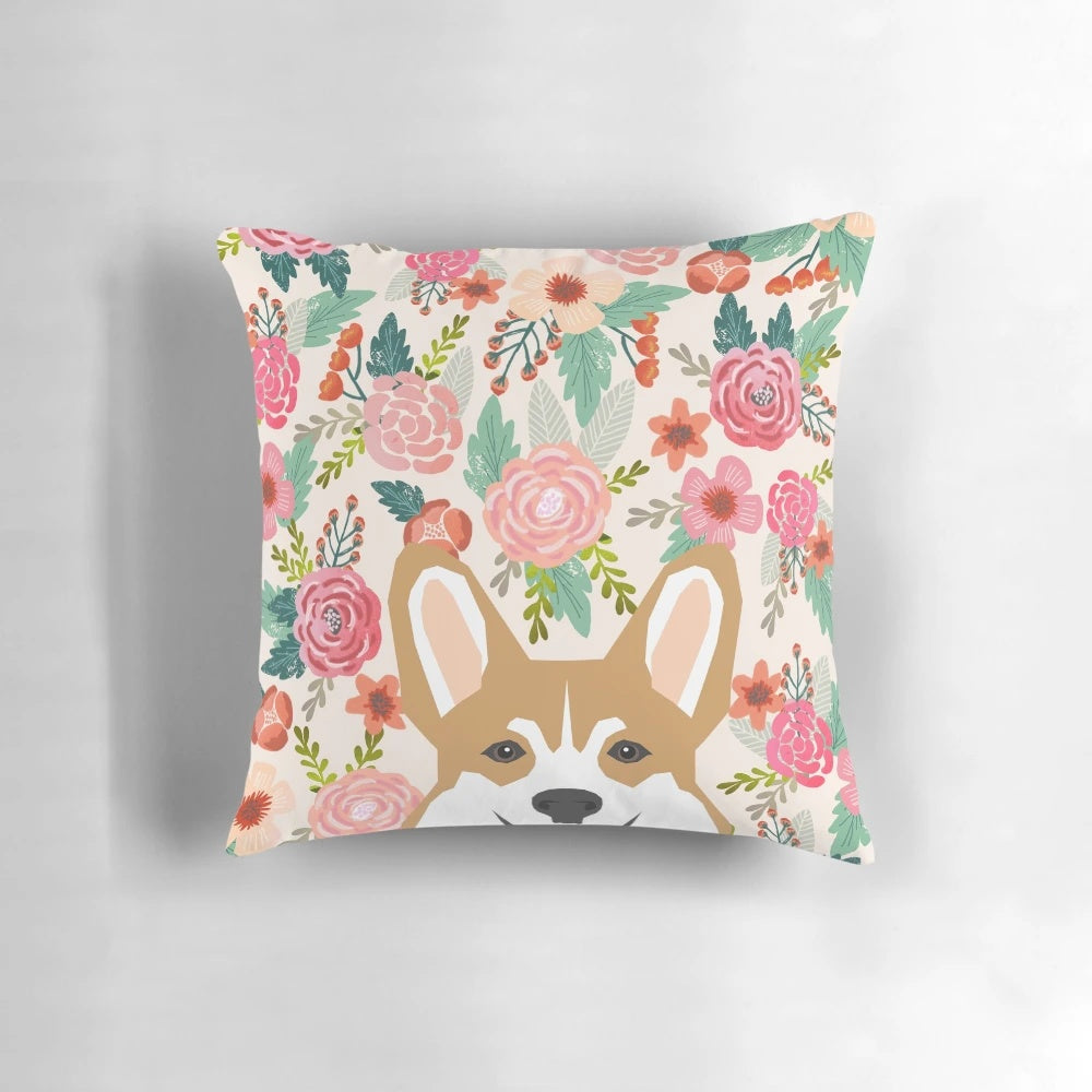 A colorful pillow featuring a beautiful Welsh Corgi surrounded by vibrant floral patterns.