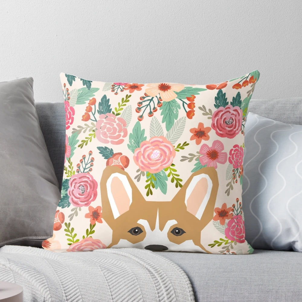 A colorful pillow featuring a beautiful Welsh Corgi surrounded by vibrant floral patterns.