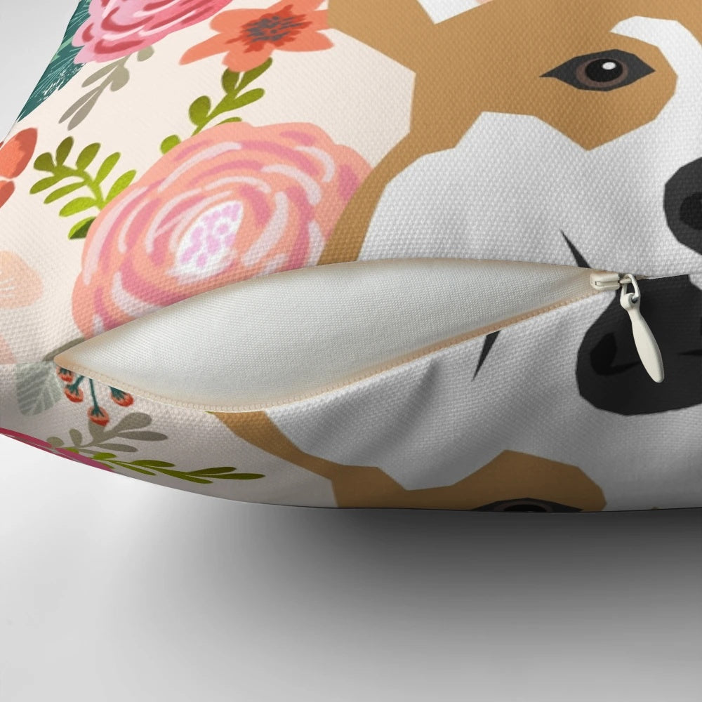 A colorful pillow featuring a beautiful Welsh Corgi surrounded by vibrant floral patterns.