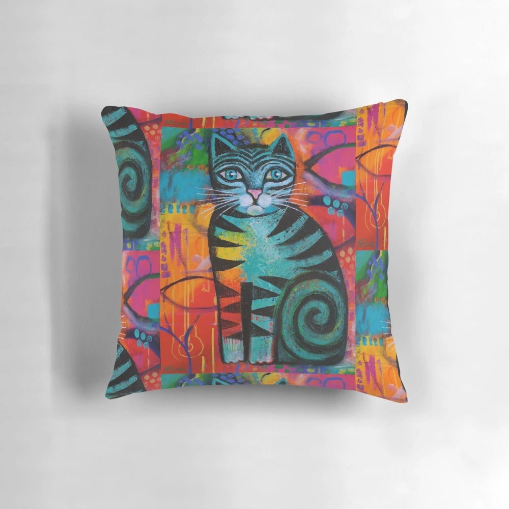 Pillow featuring a vibrant, whimsical painting of a colorful feline by artist Karin Zeller.