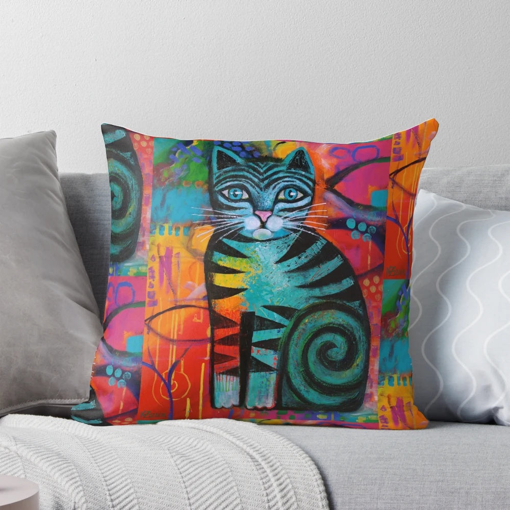 Pillow featuring a vibrant, whimsical painting of a colorful feline by artist Karin Zeller.