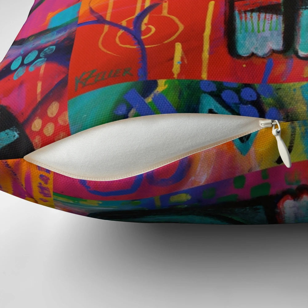 Pillow featuring a vibrant, whimsical painting of a colorful feline by artist Karin Zeller.