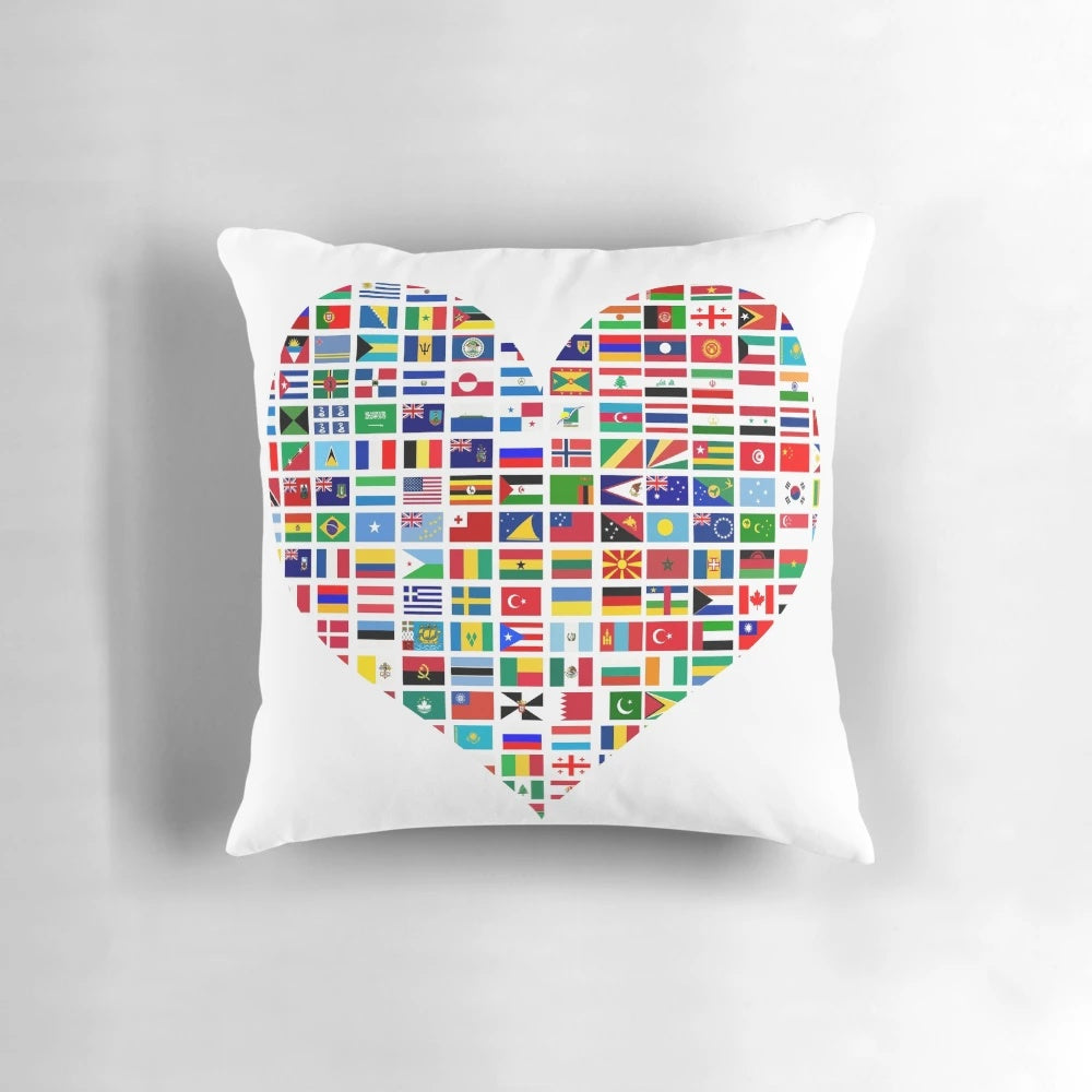 Colorful heart-shaped pillow featuring flags from countries around the world