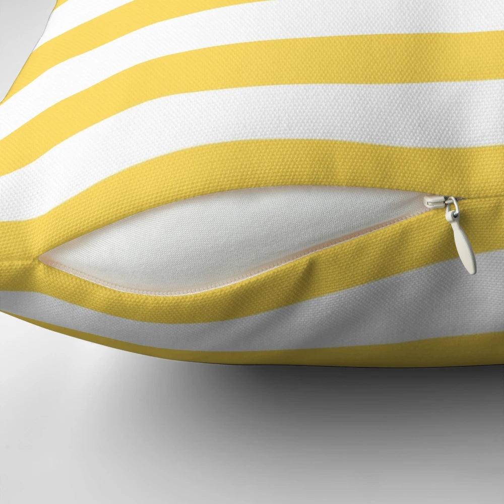 A cozy and stylish yellow and white horizontal striped decorative pillow.