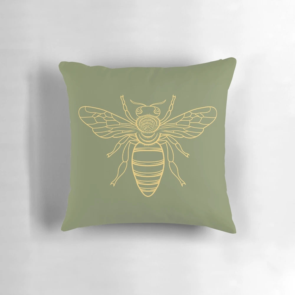 A vibrant yellow pillow with a repeating bee pattern, perfect for adding a touch of nature-inspired charm to your home.