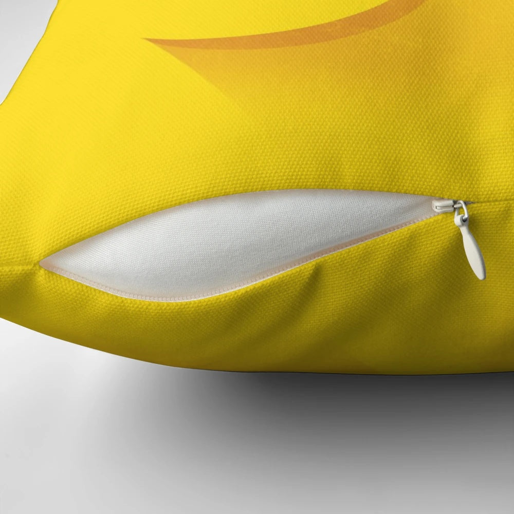 Closeup image of a yellow brick-inspired pillow with a minimalist, LEGO-inspired design.