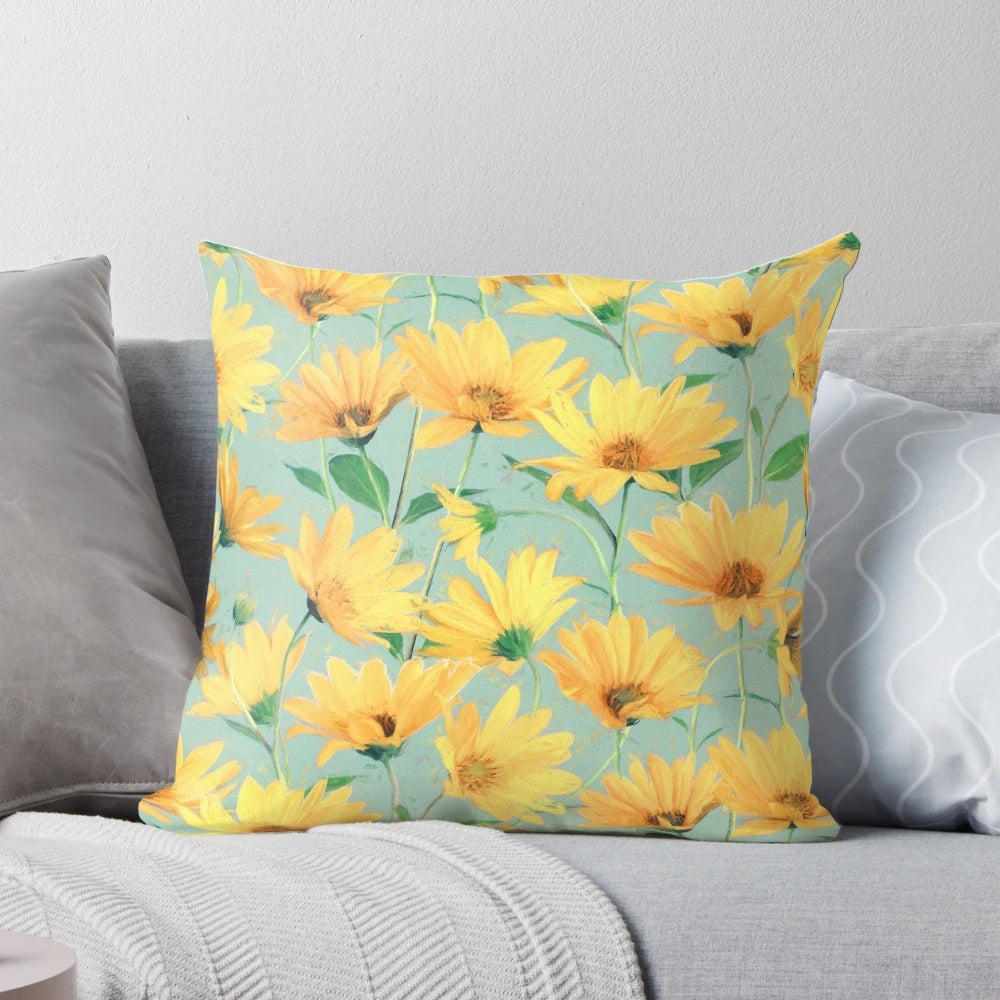 Vibrant yellow daisies painted on a soft sage green pillow, perfect for cottage core home decor.