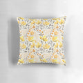 Colorful watercolor-style yellow flowers and foliage on a throw pillow