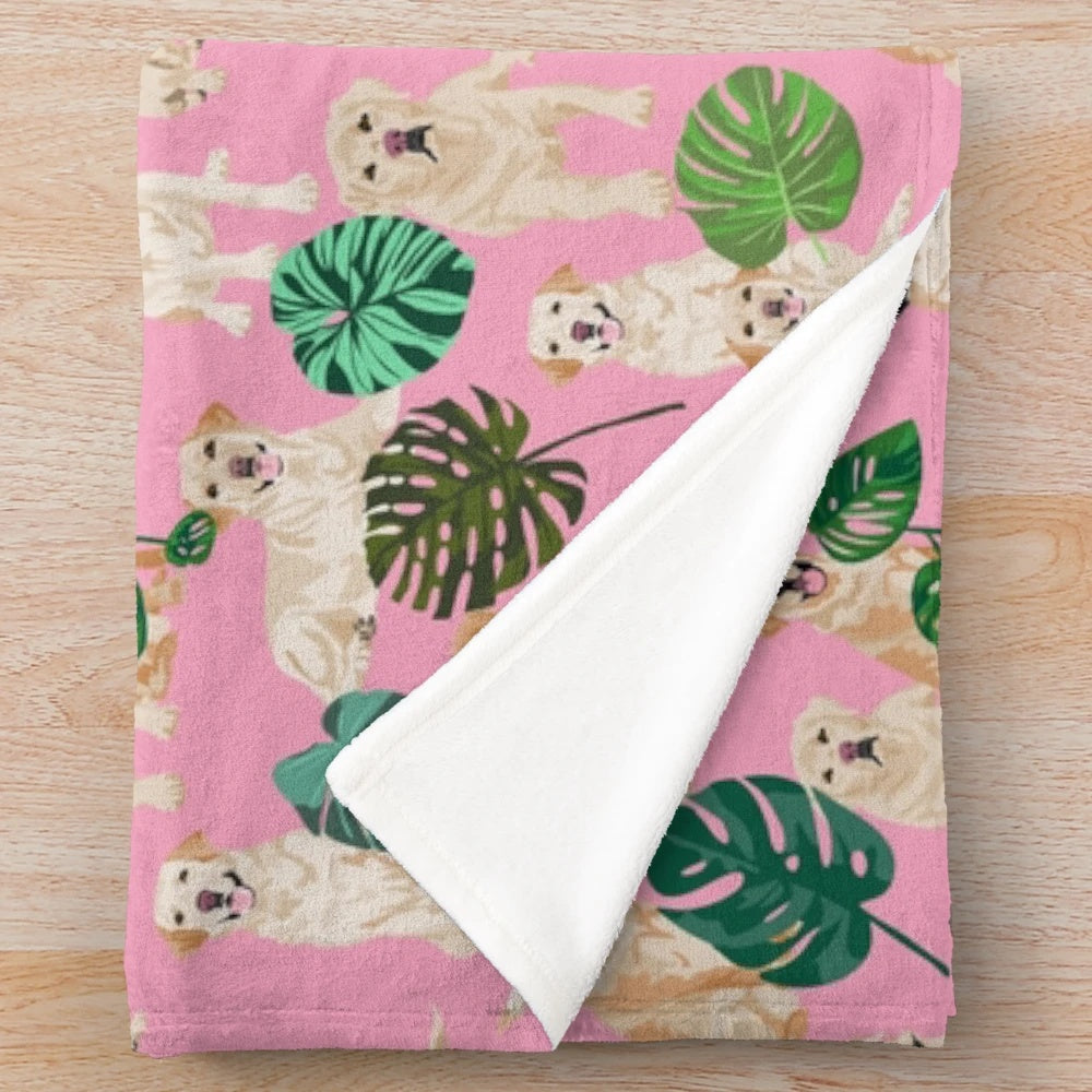 Yellow labrador retriever dog breed on a tropical pink plush blanket