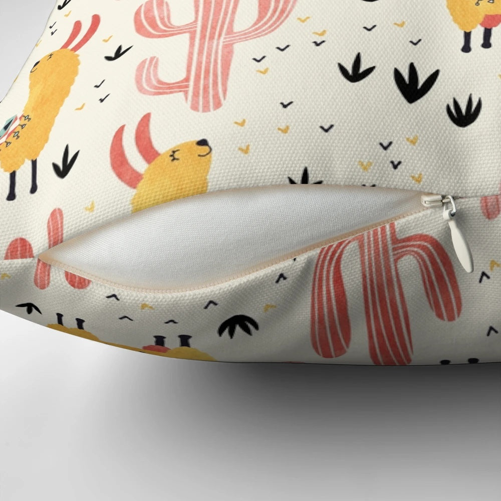 Colorful throw pillow featuring a whimsical yellow llama and red cacti design