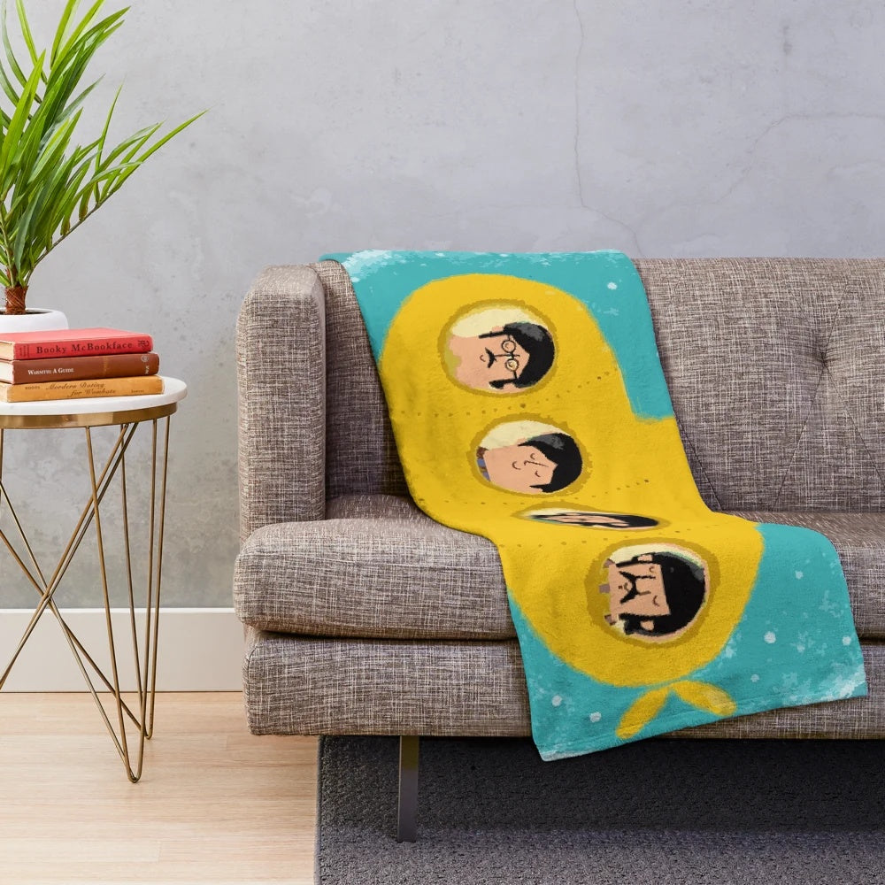 Yellow plush blanket with 60s psychedelic patterns