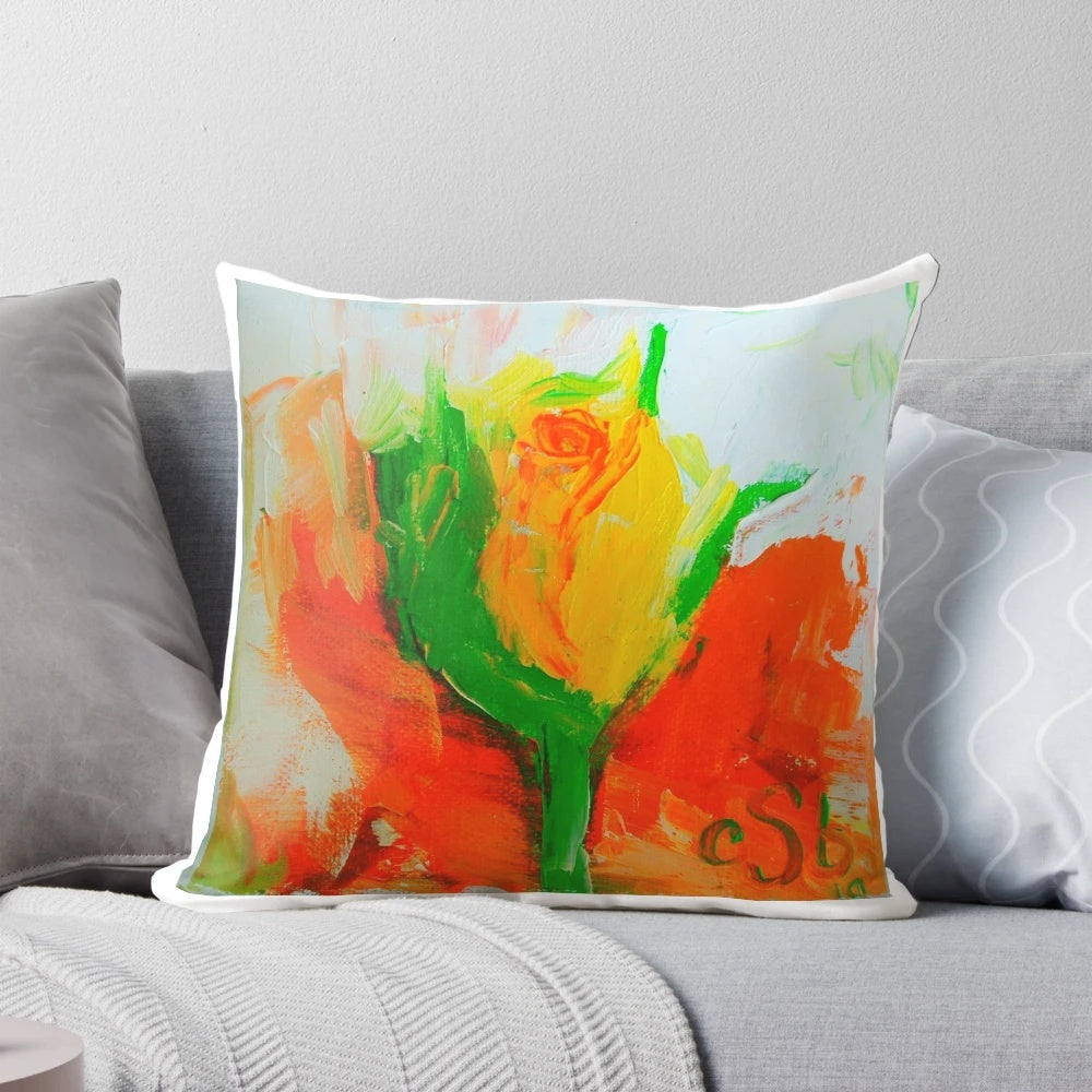 A beautiful yellow rosebud floral design on a decorative pillow for home decor.