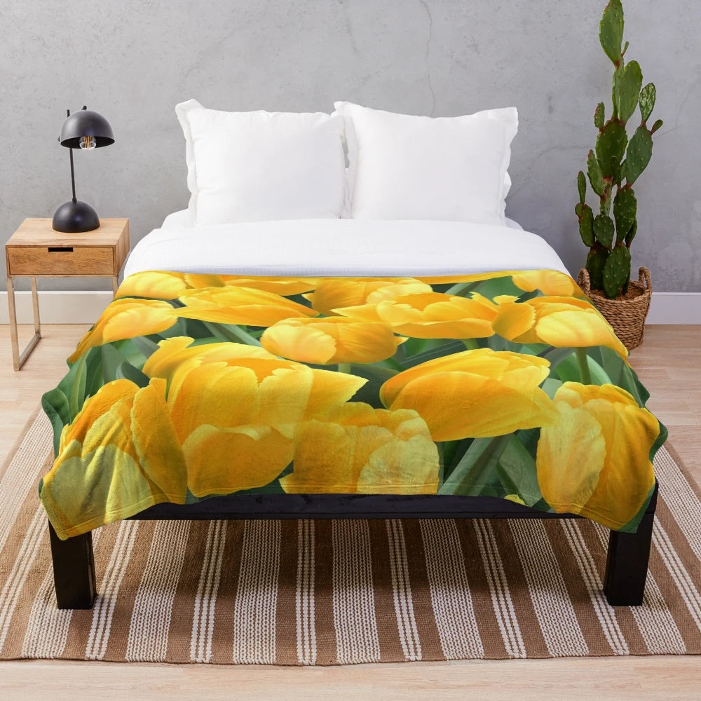 Yellow tulips in a field plush blanket