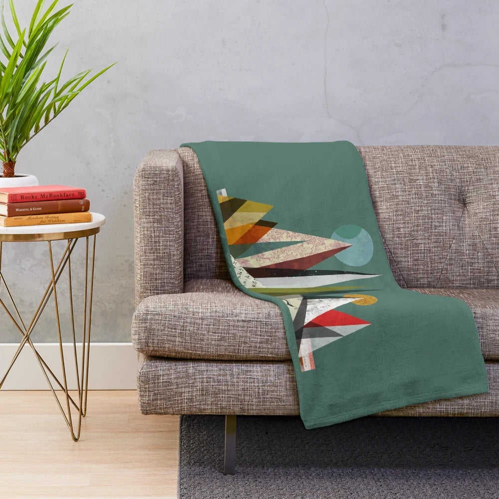 Colorful plush blanket featuring abstract shapes and landscapes inspired by the indie rock band Young the Giant.