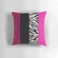 Colorful throw pillow with hot pink, black, and white animal print stripes
