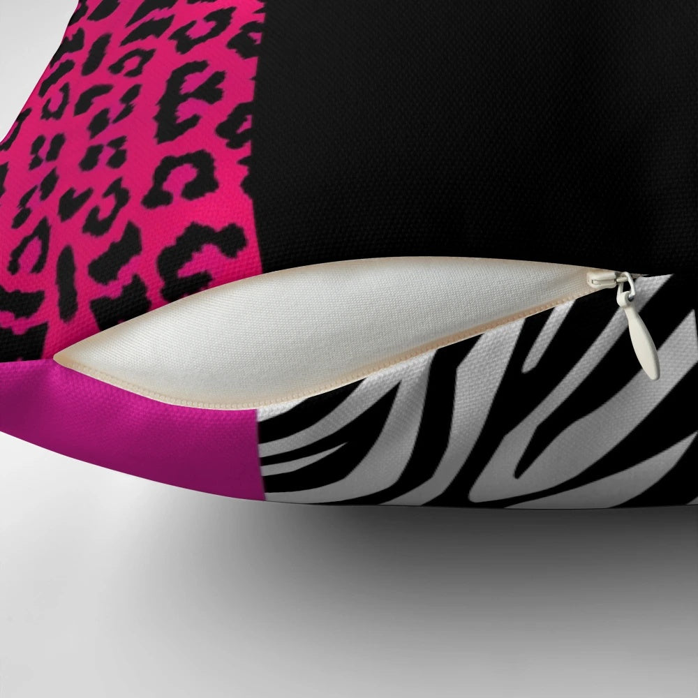 Colorful throw pillow with hot pink, black, and white animal print stripes