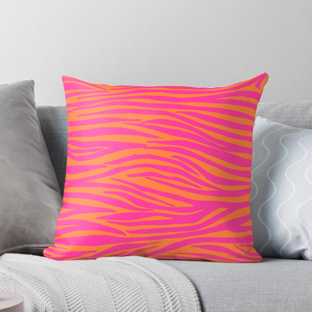 Close-up of a pink and orange zebra-striped decorative pillow
